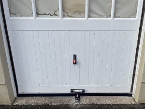 old Secure garage door defender fitted to a garage in Edinburgh by Pentland Locksmiths to prevent forced entry and improve security.