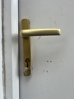 Attempted break-in using lock-snapping method on a UPVC door in Edinburgh, showing damaged lock targeted by thieves trying to steal the homeowner’s car.